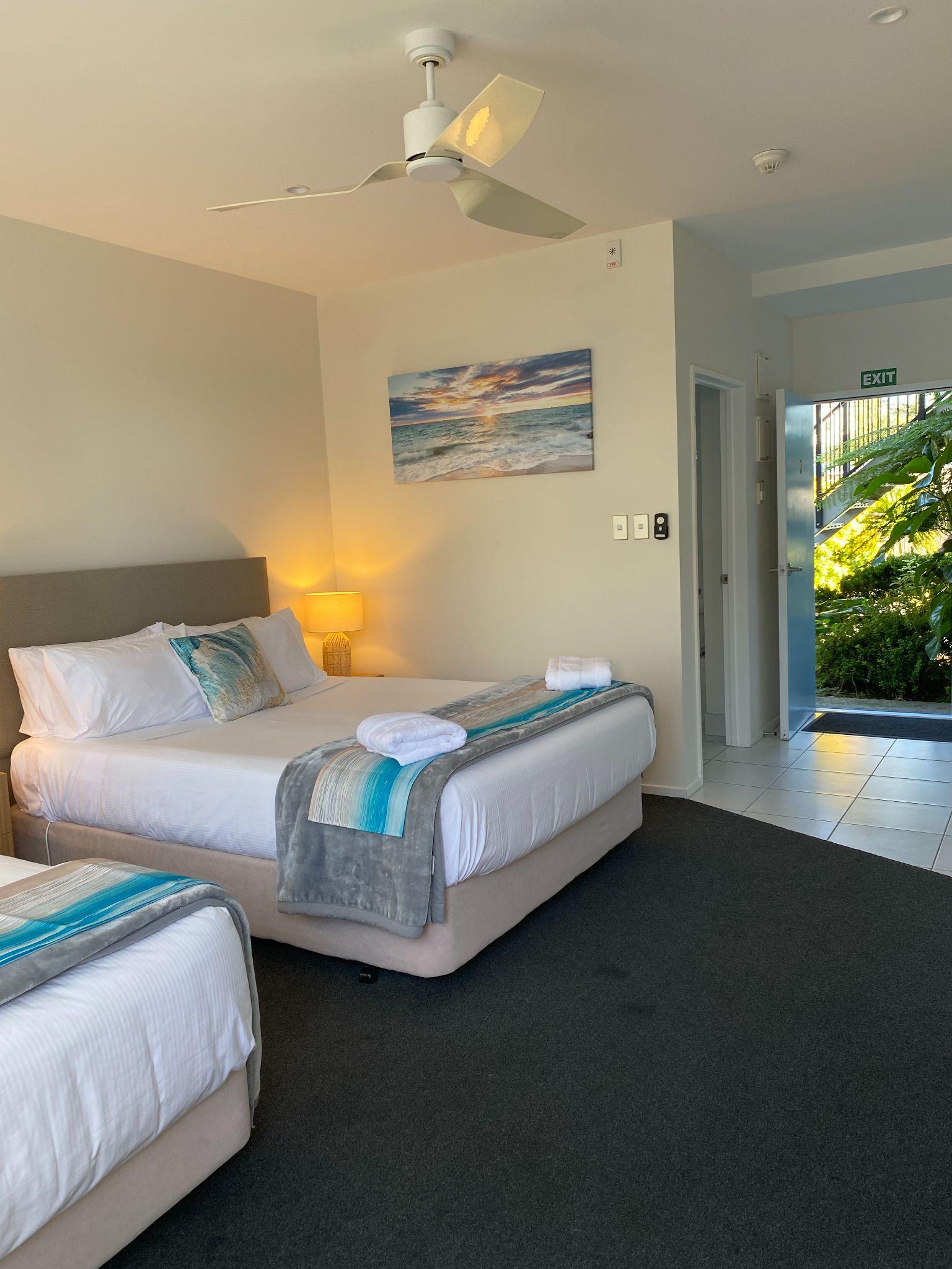 Interior with queen bed and single bed in the studio